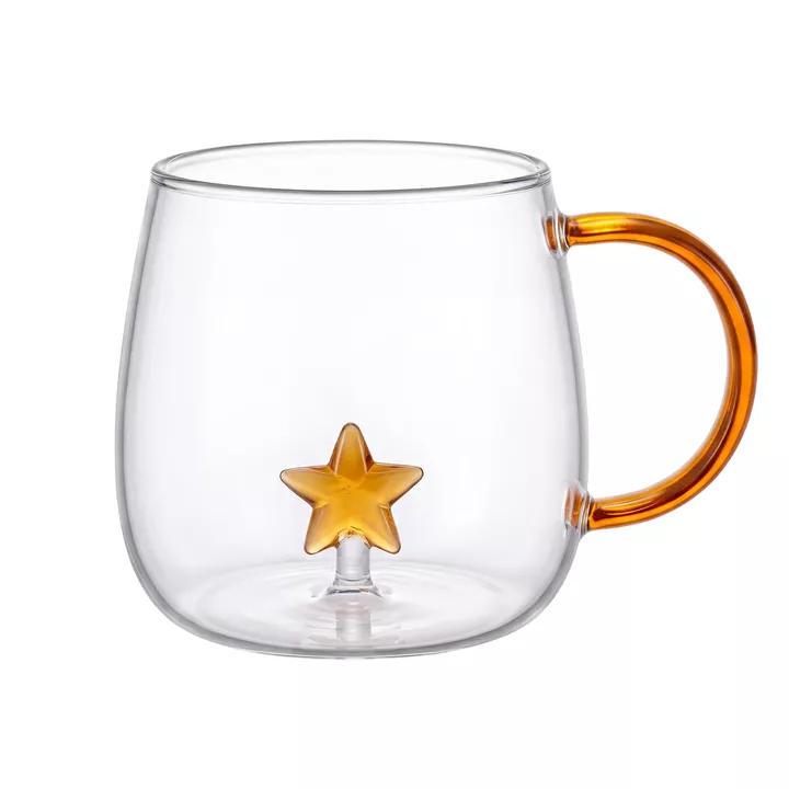 Bild på Tekopp i glas med stjärna